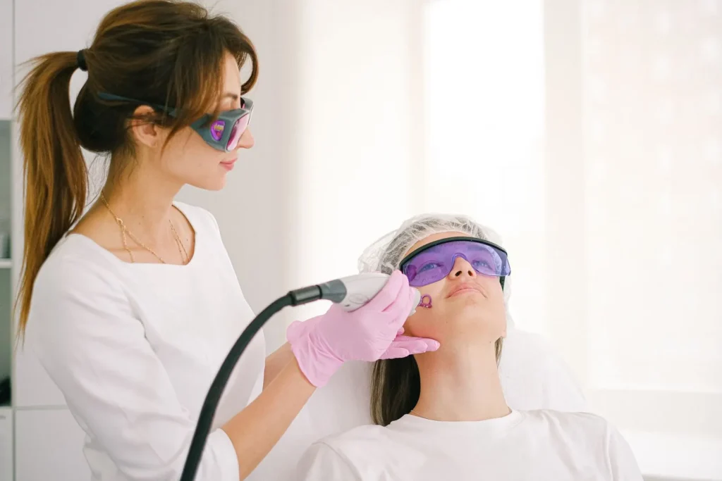 Aesthetician performing a laser facial