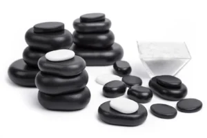 Black massage stones on white