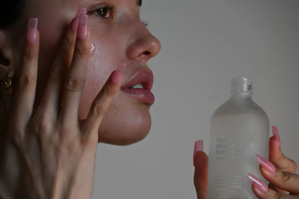 Applying serum to the face