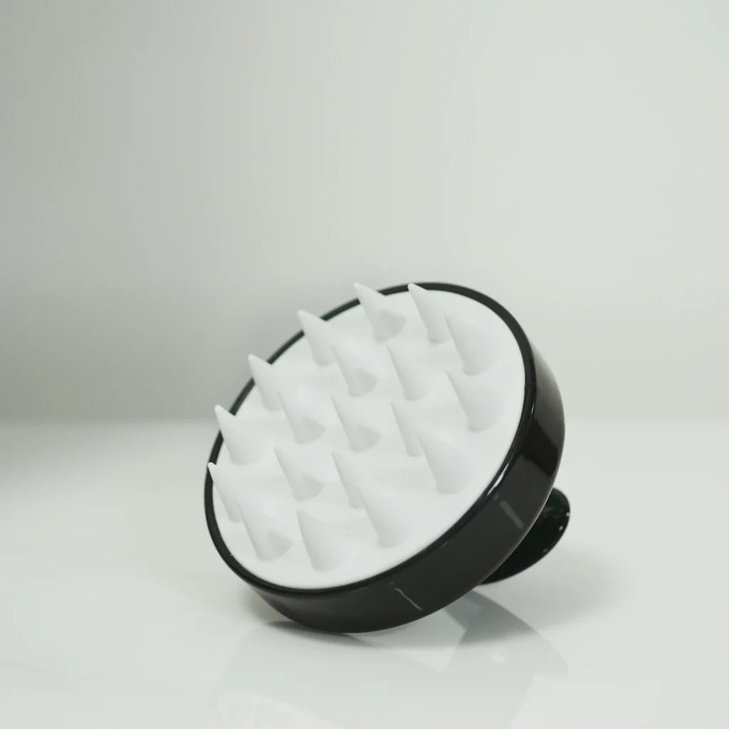 Scalp massager with soft bristles